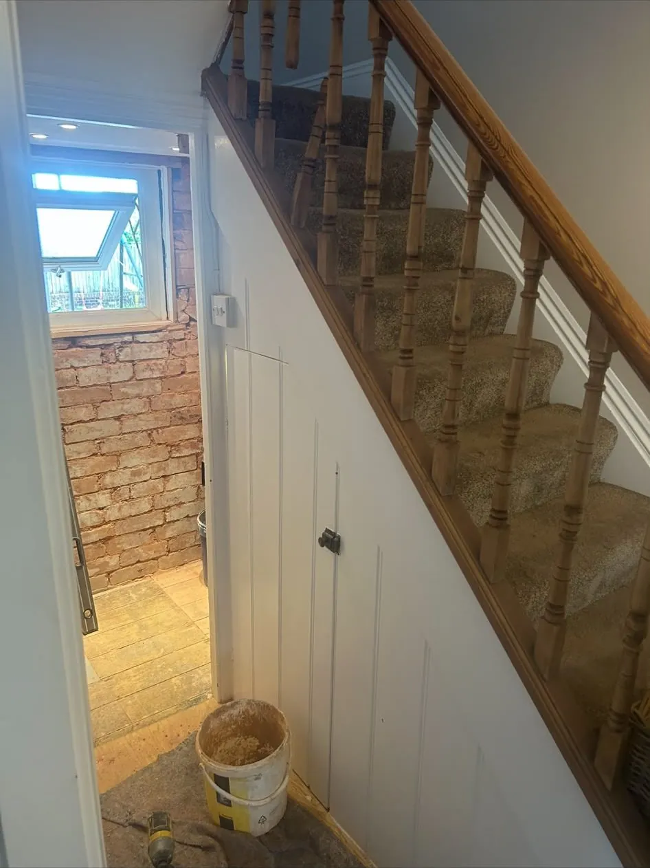 Under stairs panelled cupboard – bespoke furniture & wardrobes by JCK Carpentry & Building, Exeter