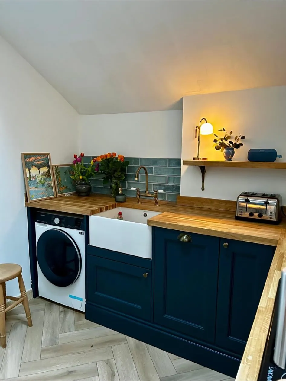 Navy kitchen with Belfast sink fitted in Exeter