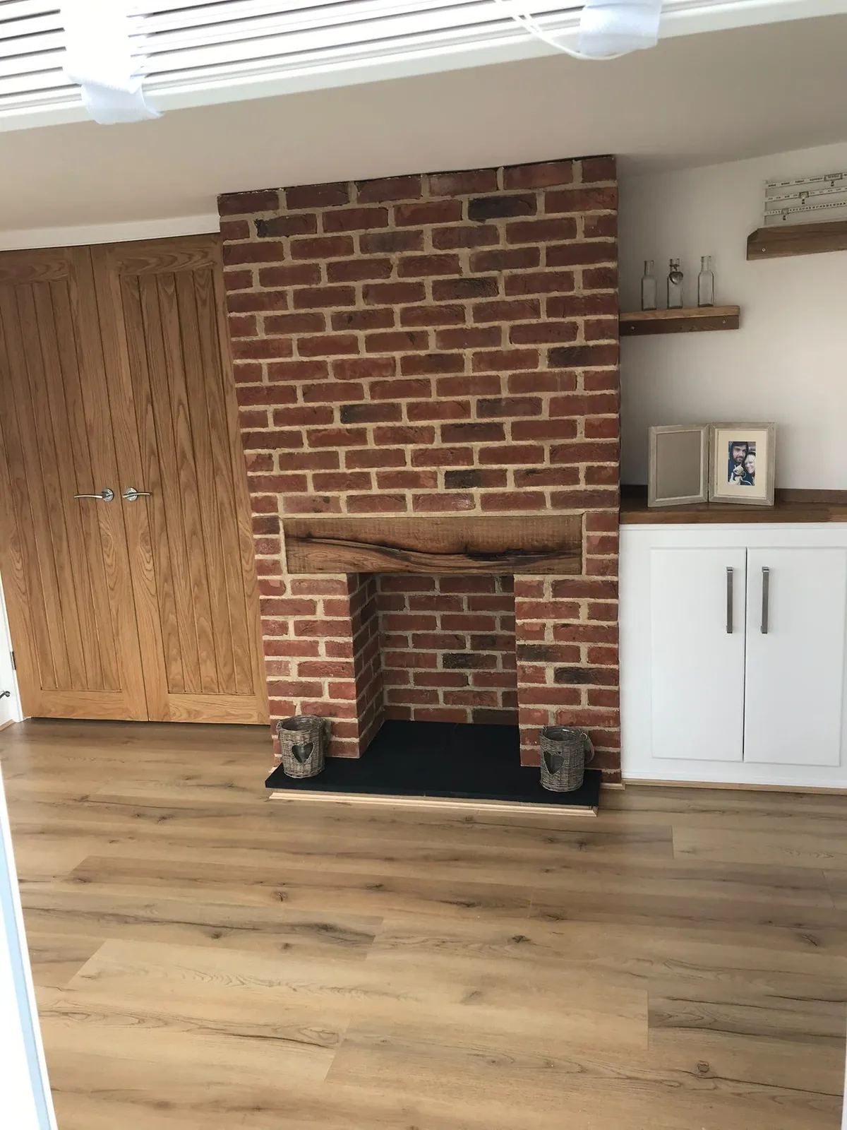 Brick fireplace oak mantel doors 04 – carpentry by JCK Carpentry & Building, Exeter